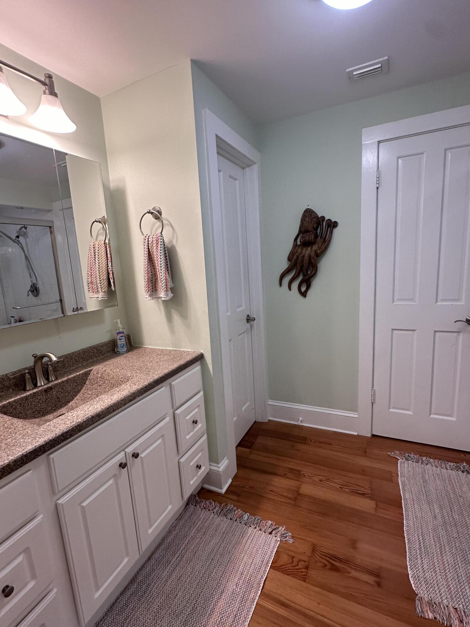 817 Eaton Street, Unit 1 Key West, FL 33040 - Photo 21 of 30 a bathroom with a sink and a mirror