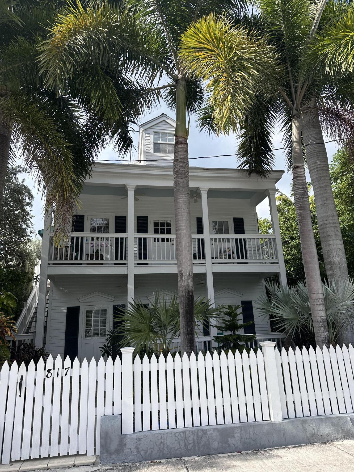 817 Eaton Street, Unit 1 Key West, FL 33040 - Photo 5 of 30 a front view of a house with a garden