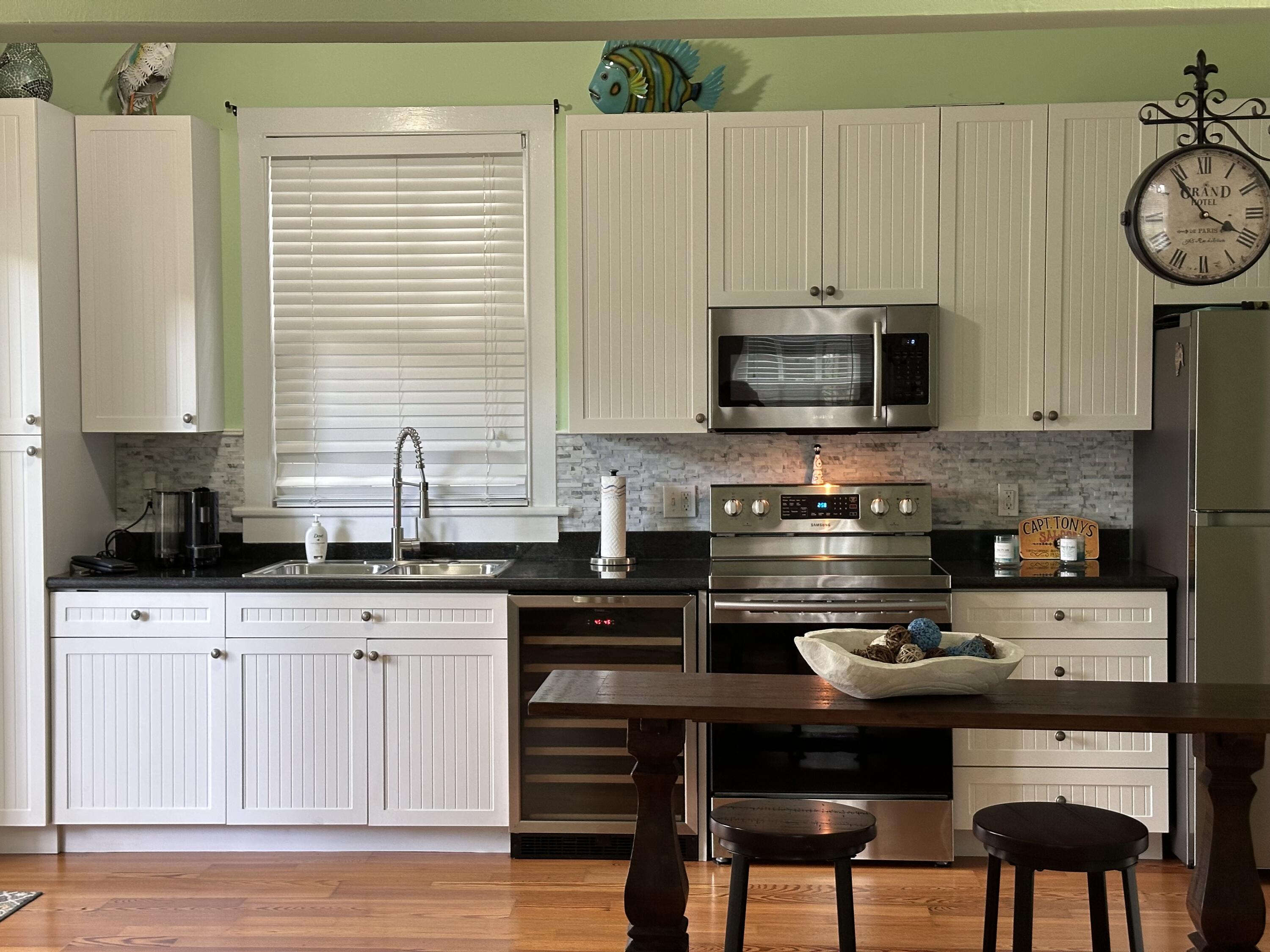 817 Eaton Street, Unit 1 Key West, FL 33040 - Photo 6 of 30 a kitchen with a cabinets and appliances