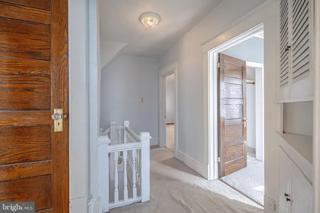 a view of an entryway with wooden floor