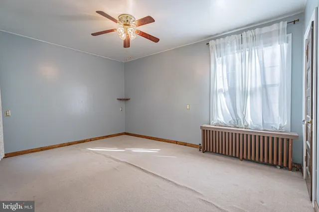 a view of a room with wooden floor and stairs