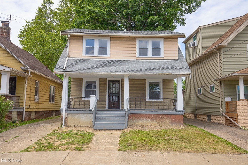 3538 Independence Road Cleveland, OH 44105 - Photo 24 of 24 View of front of property featuring covered porch, roof with shingles, and cooling unit