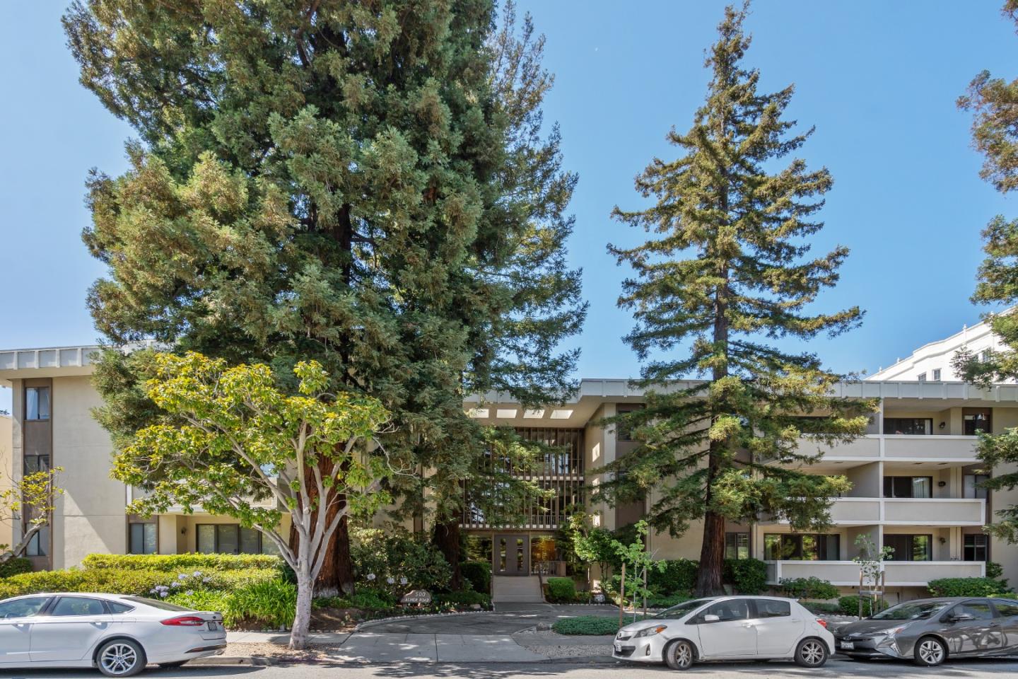 500 Almer Road, Unit 208 Burlingame, CA 94010 - Photo 1 of 30 a city street lined with buildings and trees