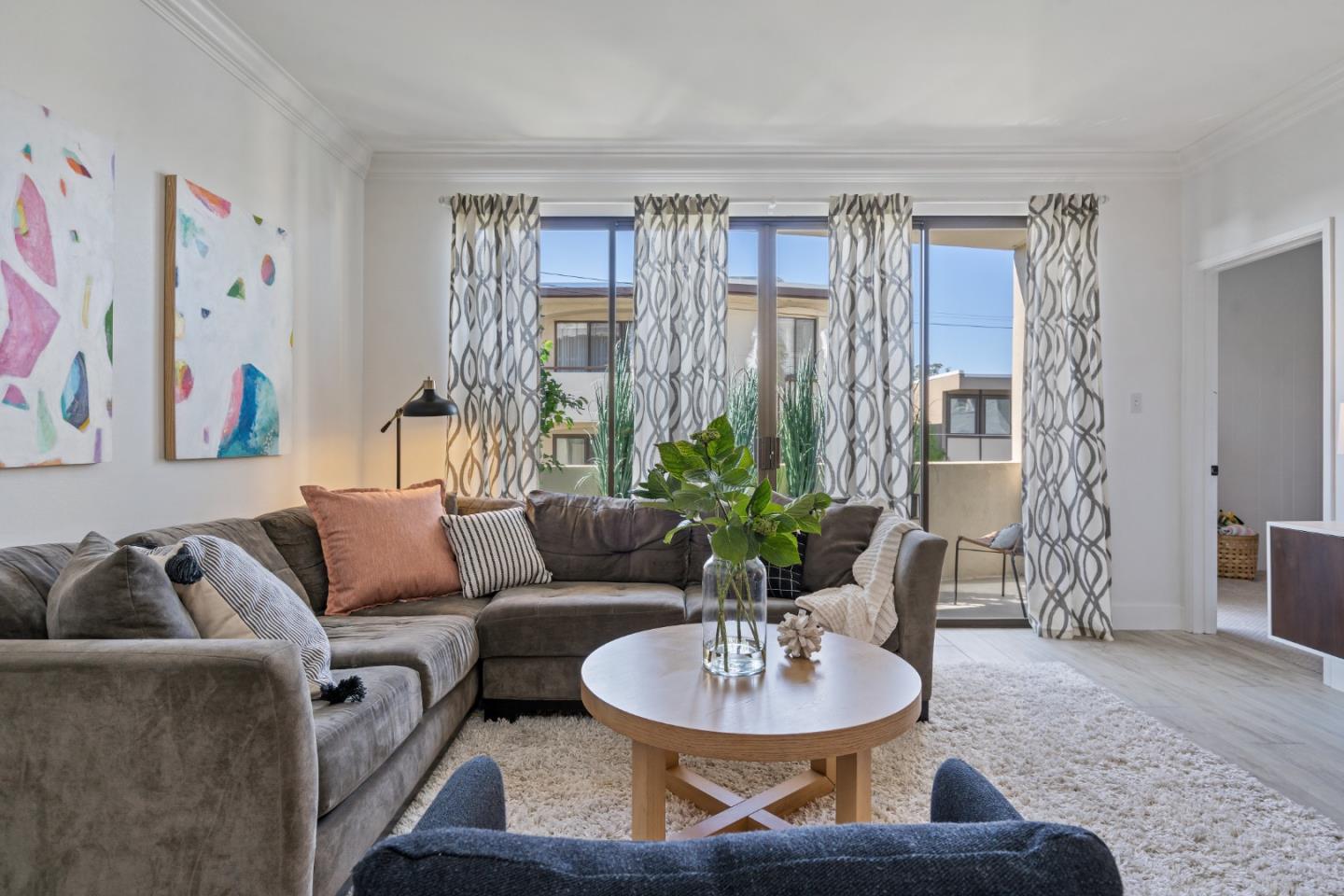 500 Almer Road, Unit 208 Burlingame, CA 94010 - Photo 11 of 30 a living room with furniture and a potted plant
