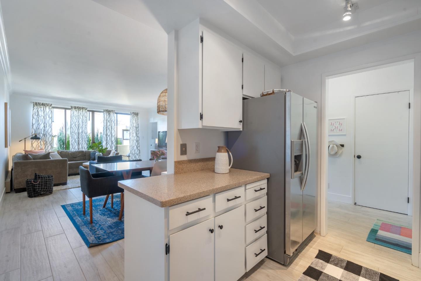 500 Almer Road, Unit 208 Burlingame, CA 94010 - Photo 16 of 30 a kitchen with a refrigerator and a sink