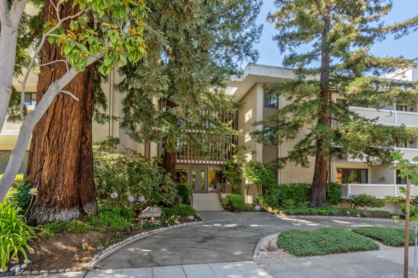 500 Almer Road, Unit 208 Burlingame, CA 94010 - Photo 2 of 30 a front view of a house with a yard