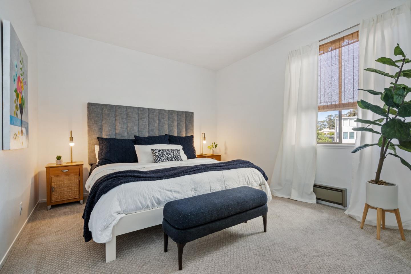 500 Almer Road, Unit 208 Burlingame, CA 94010 - Photo 22 of 30 a bed room with a bed and a chair