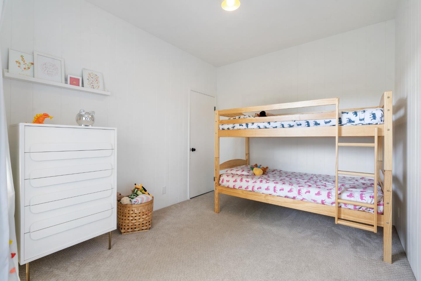 500 Almer Road, Unit 208 Burlingame, CA 94010 - Photo 23 of 30 a room with a baby crib and a dresser