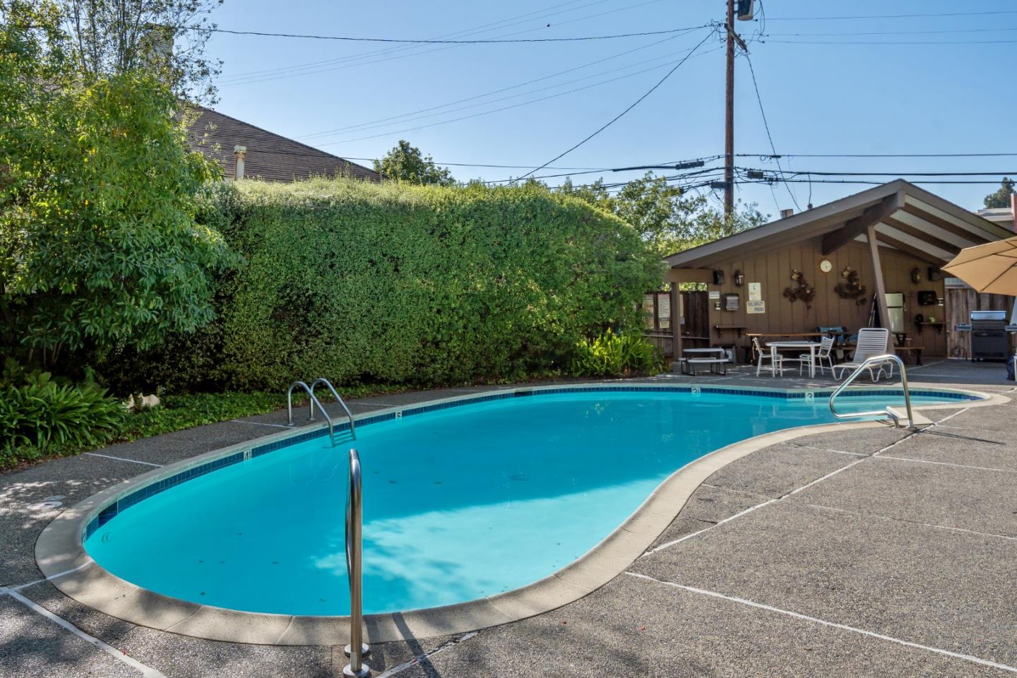 500 Almer Road, Unit 208 Burlingame, CA 94010 - Photo 27 of 30 a view of a swimming pool with a patio
