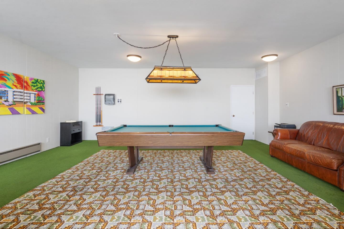 500 Almer Road, Unit 208 Burlingame, CA 94010 - Photo 7 of 30 a living room with a couch and a table