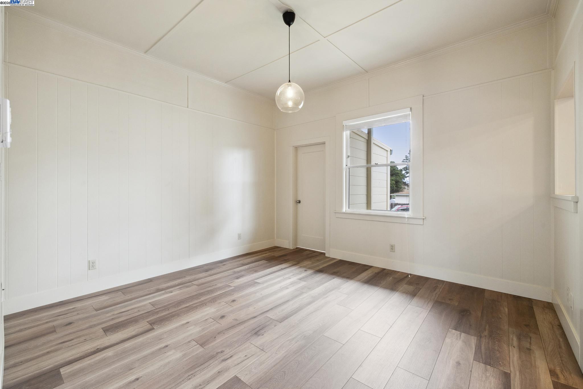 1820 3rd Street Alameda, CA 94501 - Photo 30 of 60 an empty room with wooden floor and windows