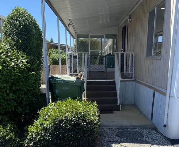 a view of a backyard with pathway