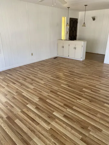 a bathroom with a sink a mirror and shower