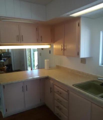 a kitchen with a sink and cabinets