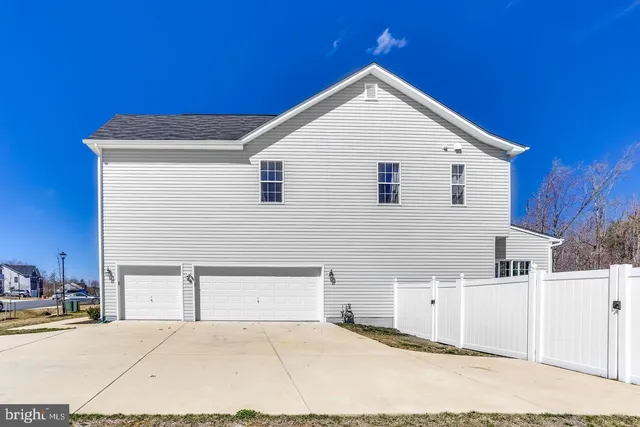 a view of house with yard