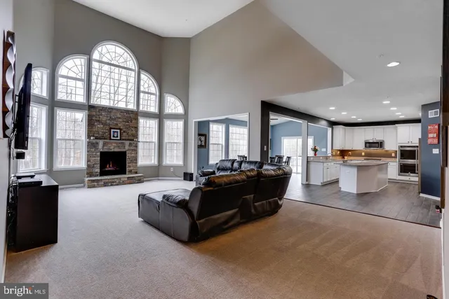 a kitchen with granite countertop a refrigerator and a sink