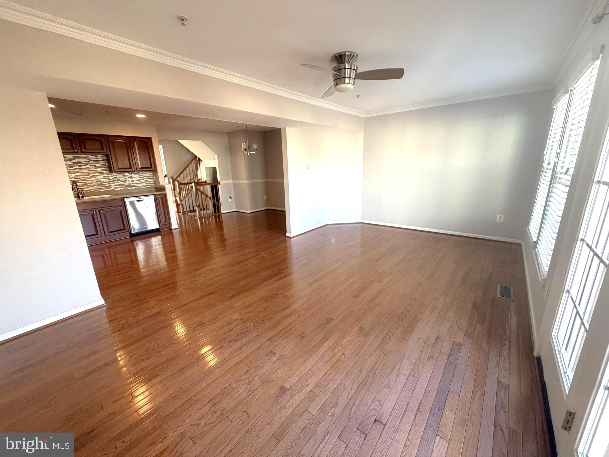 7088 Maiden Point Place, Unit 25 Elkridge, MD 21075 - Photo 13 of 29 a view of empty room with wooden floor and fan