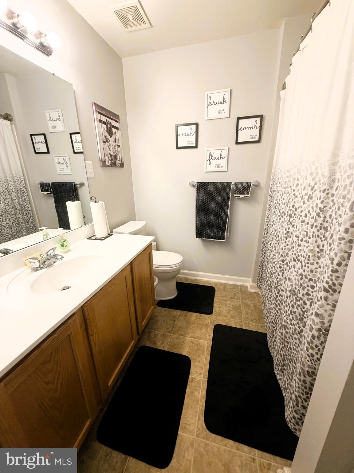 7088 Maiden Point Place, Unit 25 Elkridge, MD 21075 - Photo 17 of 29 a bathroom with a sink and a mirror