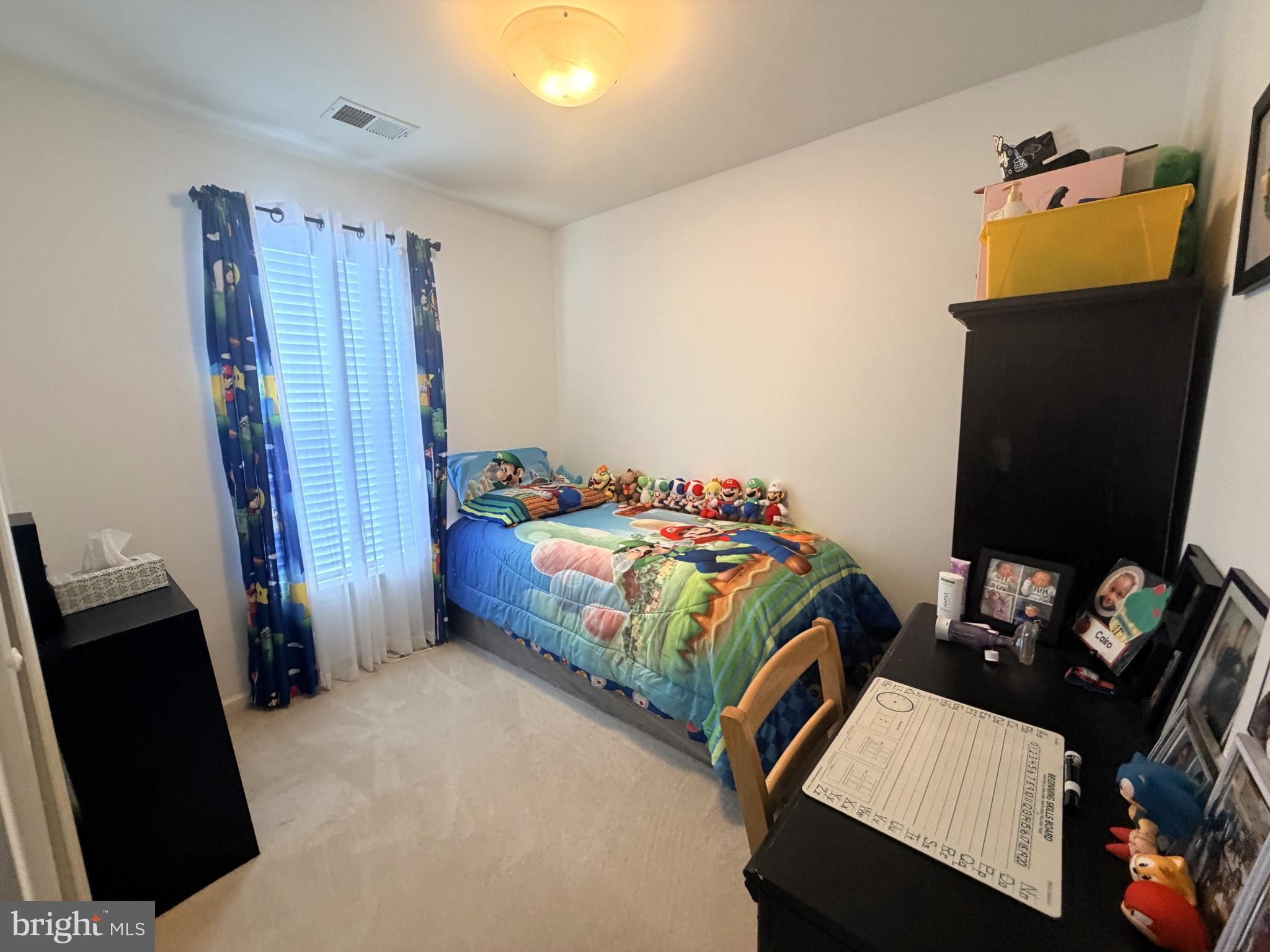7088 Maiden Point Place, Unit 25 Elkridge, MD 21075 - Photo 19 of 29 a bedroom with a bed and wooden floor