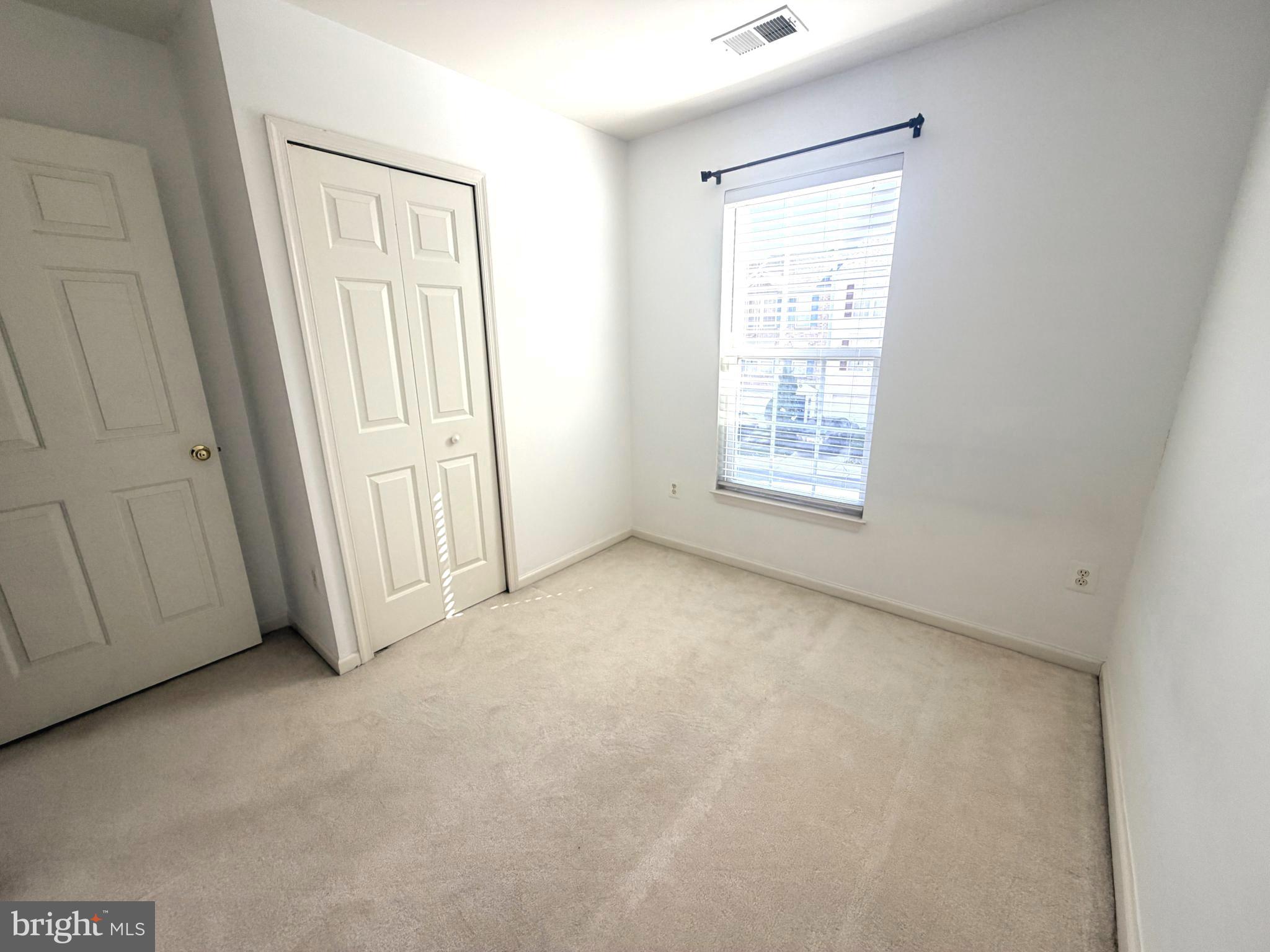 7088 Maiden Point Place, Unit 25 Elkridge, MD 21075 - Photo 20 of 29 a view of an empty room with a window