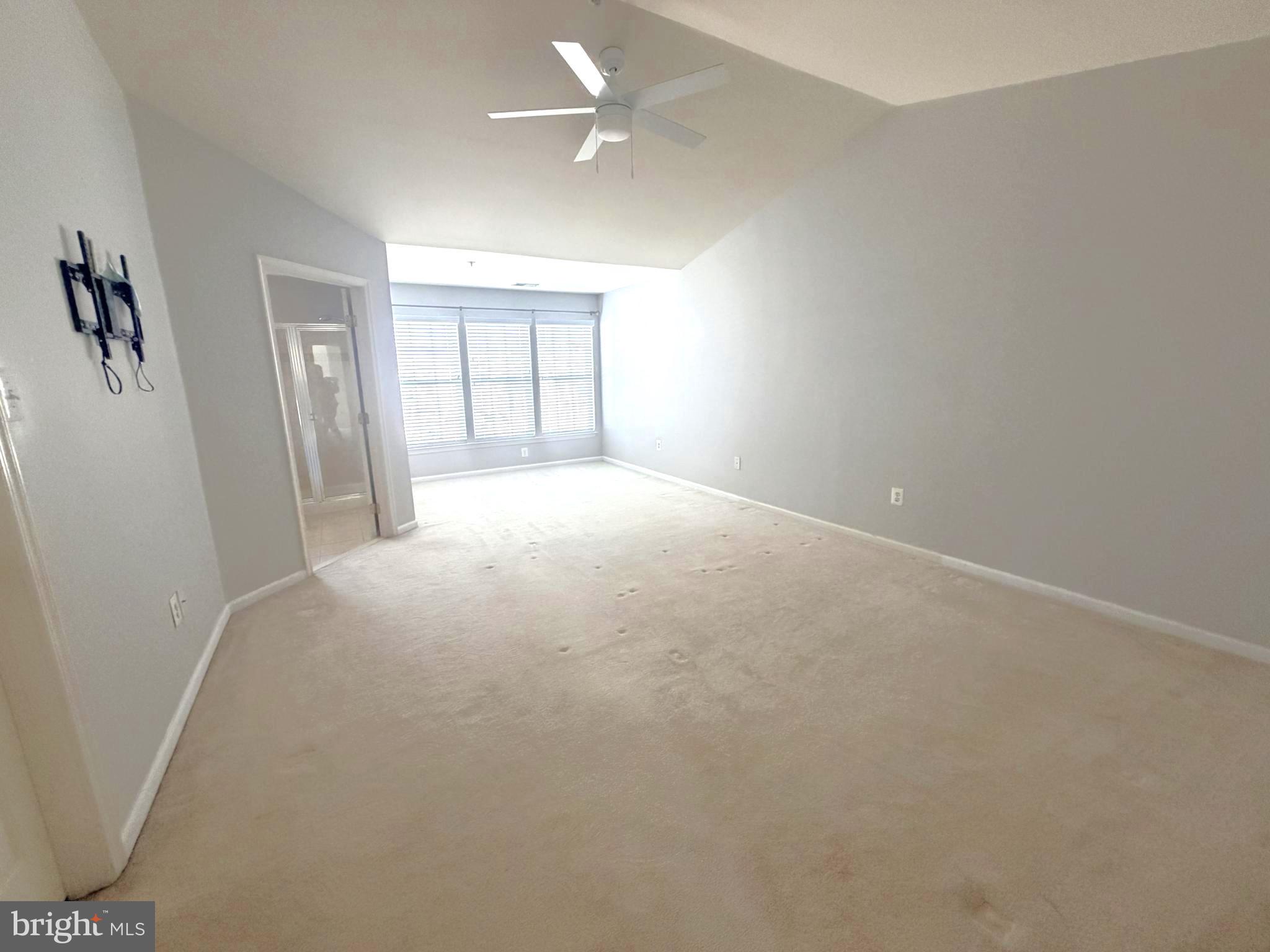 7088 Maiden Point Place, Unit 25 Elkridge, MD 21075 - Photo 21 of 29 an empty room with windows and closet