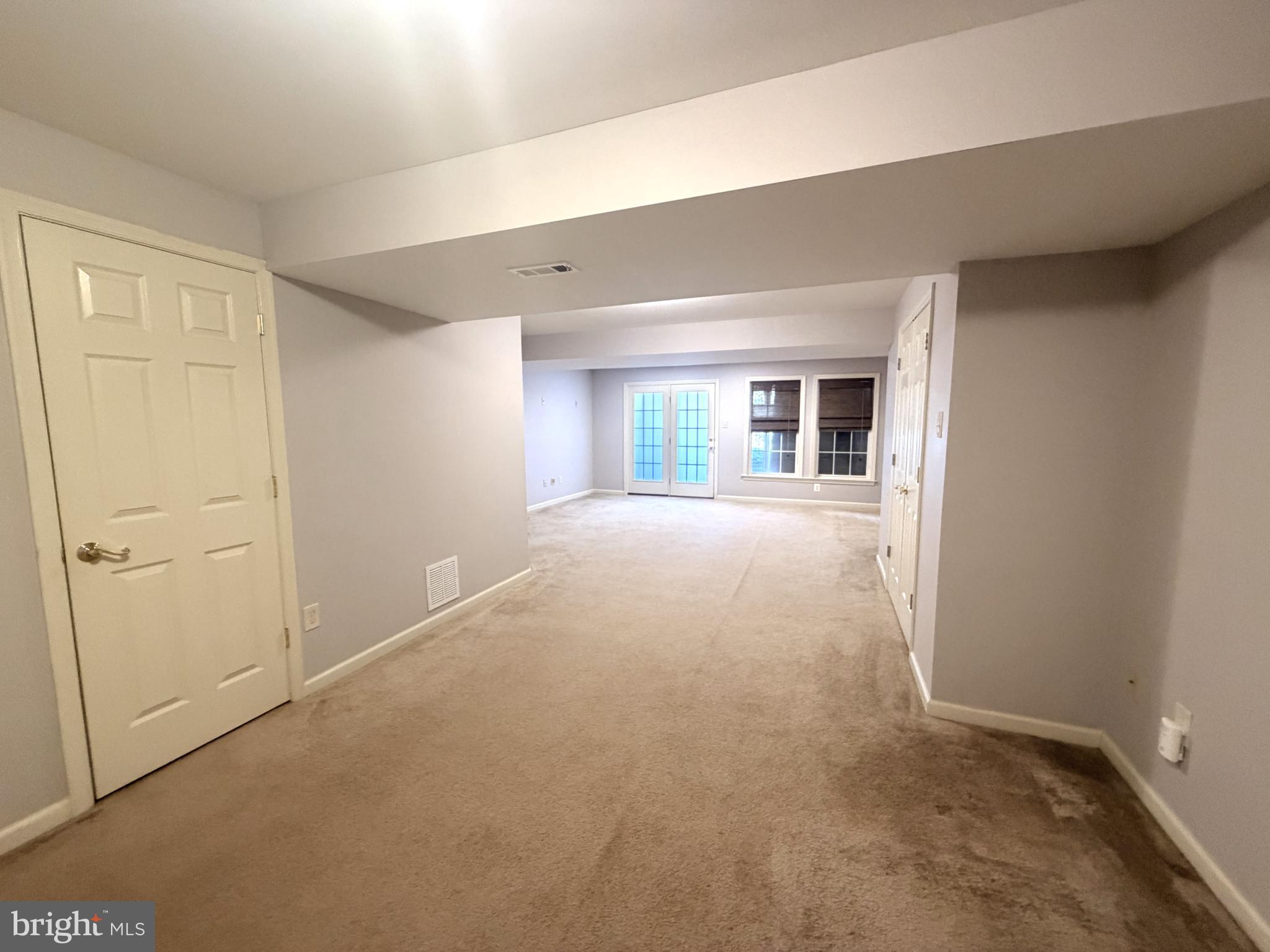 7088 Maiden Point Place, Unit 25 Elkridge, MD 21075 - Photo 25 of 29 an empty room with window