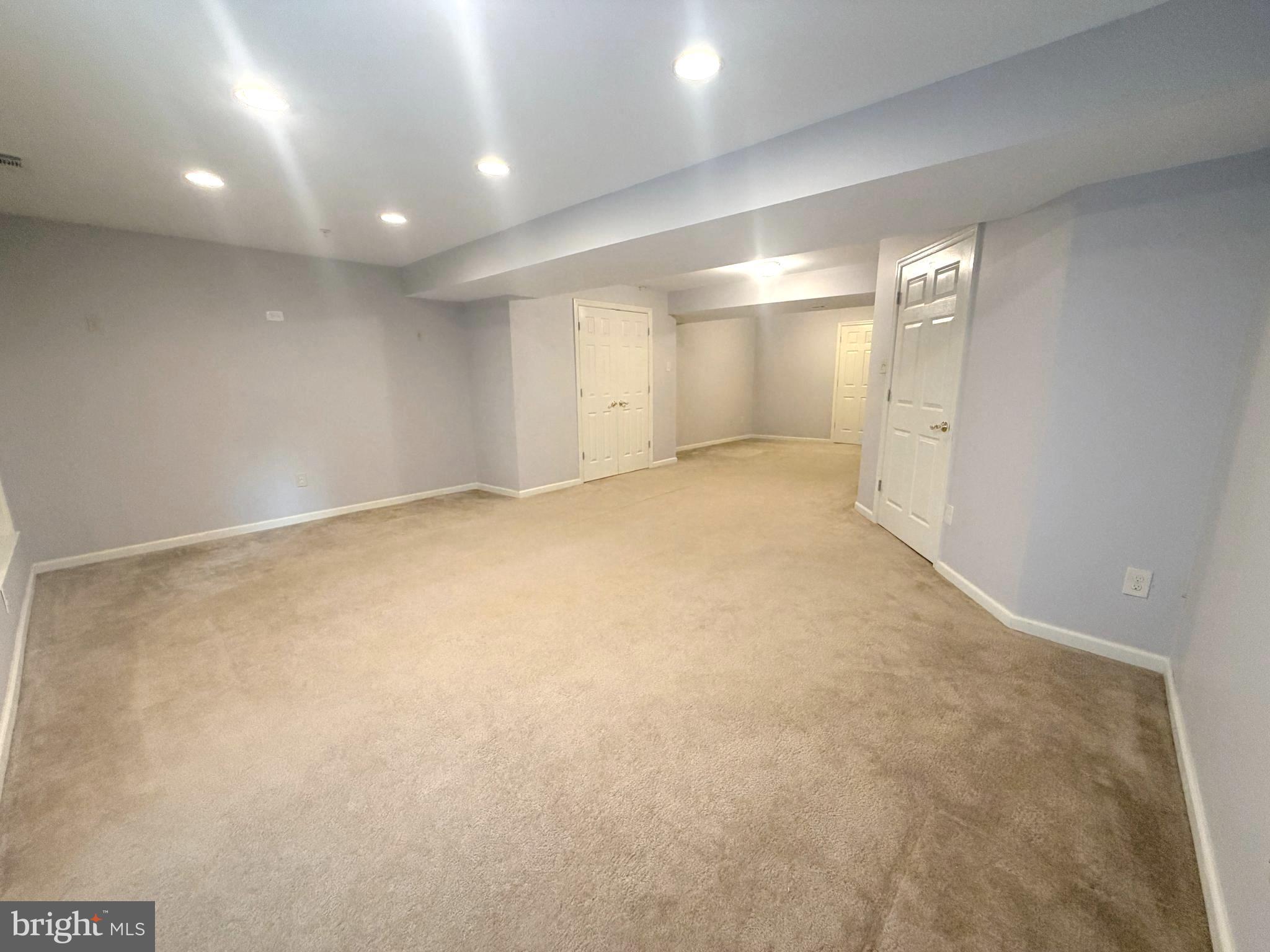 7088 Maiden Point Place, Unit 25 Elkridge, MD 21075 - Photo 26 of 29 an empty room with windows and fan