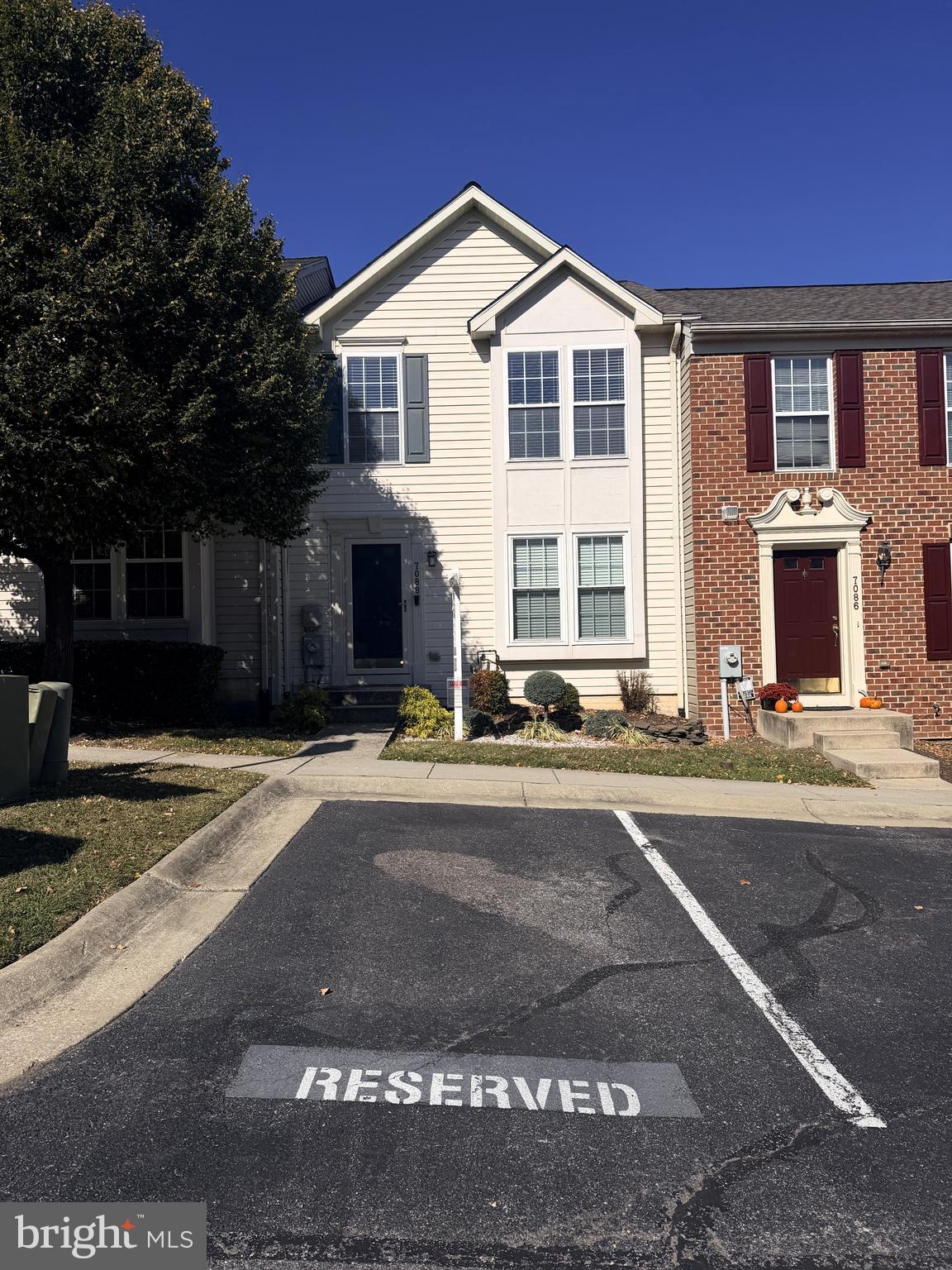 7088 Maiden Point Place, Unit 25 Elkridge, MD 21075 - Photo 29 of 29 a front view of a house with a yard