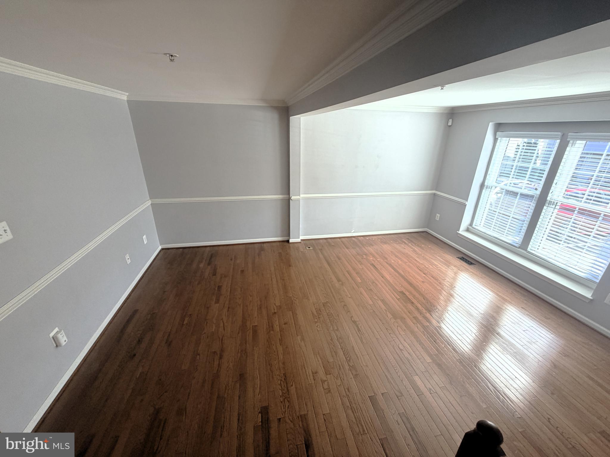 7088 Maiden Point Place, Unit 25 Elkridge, MD 21075 - Photo 3 of 29 wooden floor in an empty room with a window