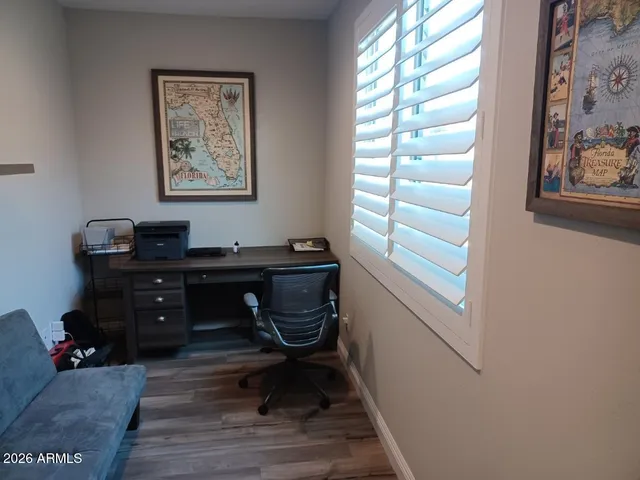 a workspace with furniture and window