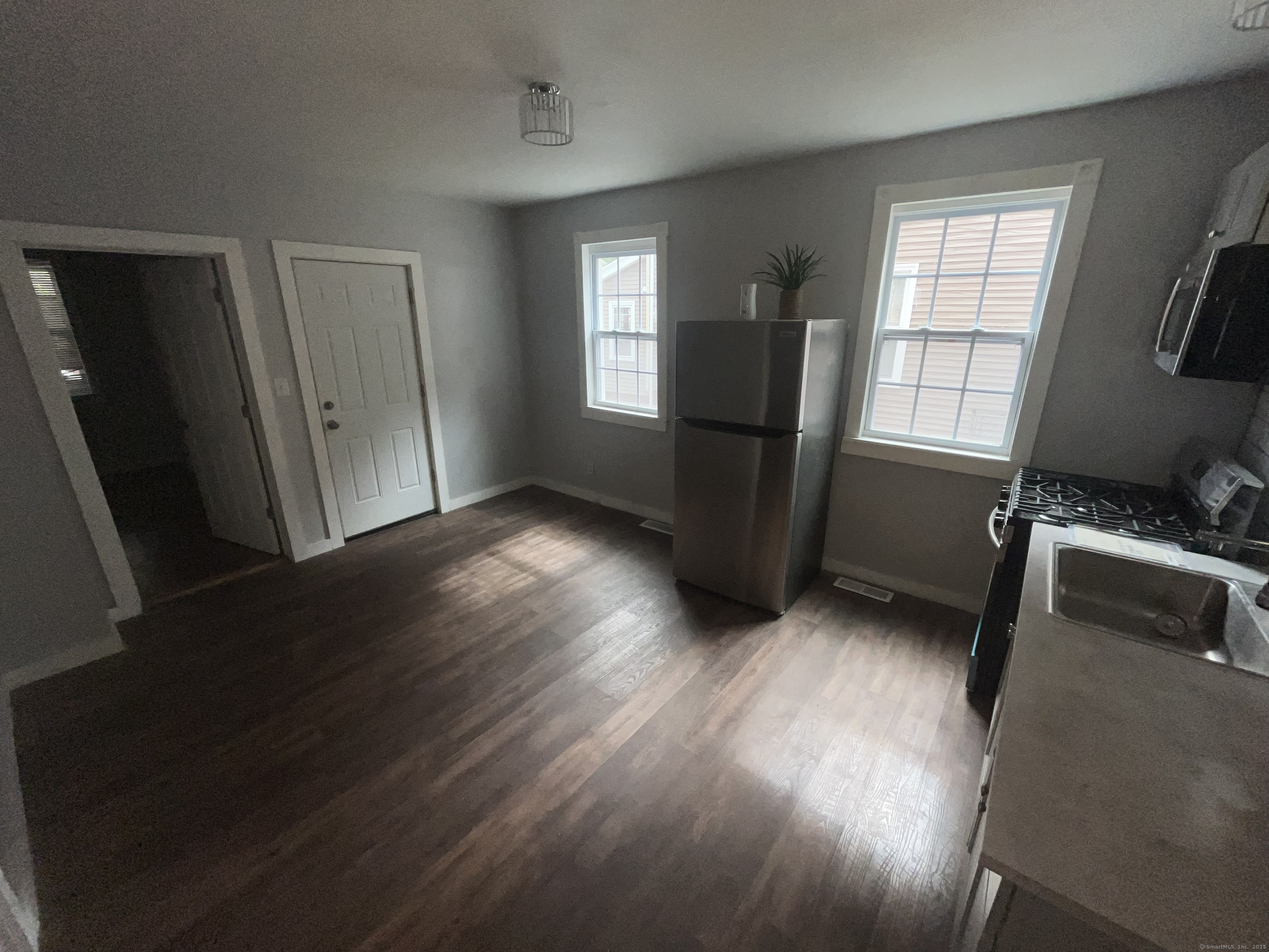 212 Newhall Street, Unit 1 New Haven, CT 06511 - Photo 3 of 6 wooden floor in an empty room with a window