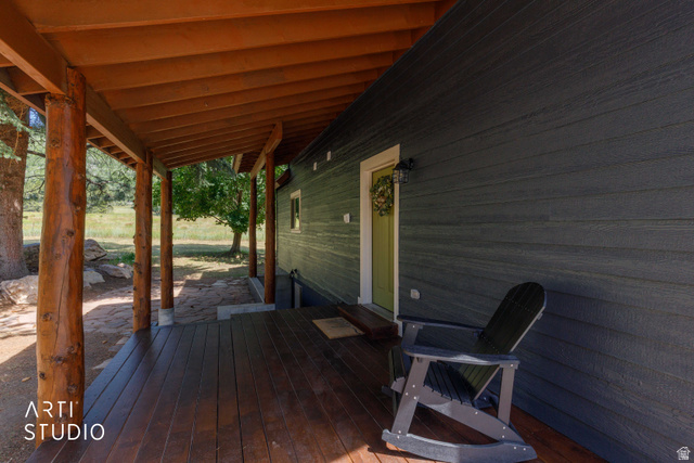 2807 North Ogden Canyon Road Eden, UT 84310 - Photo 48 of 72 Inviting covered porch featuring natural wood posts and a rich wood-finish deck