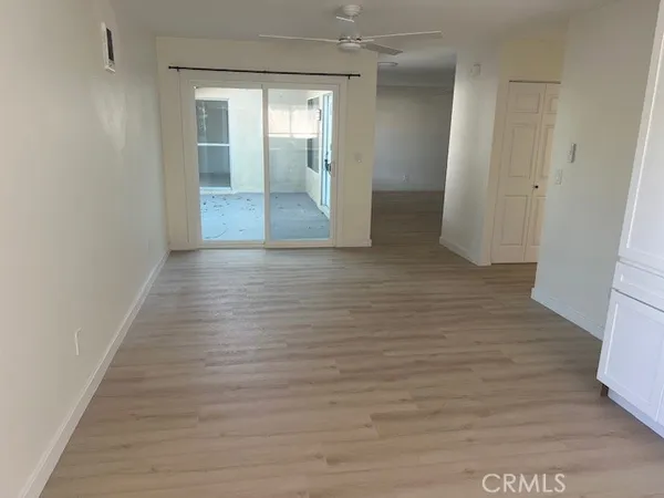 a view of hallway with wooden floor