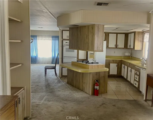 a kitchen with a sink counter top space and cabinets