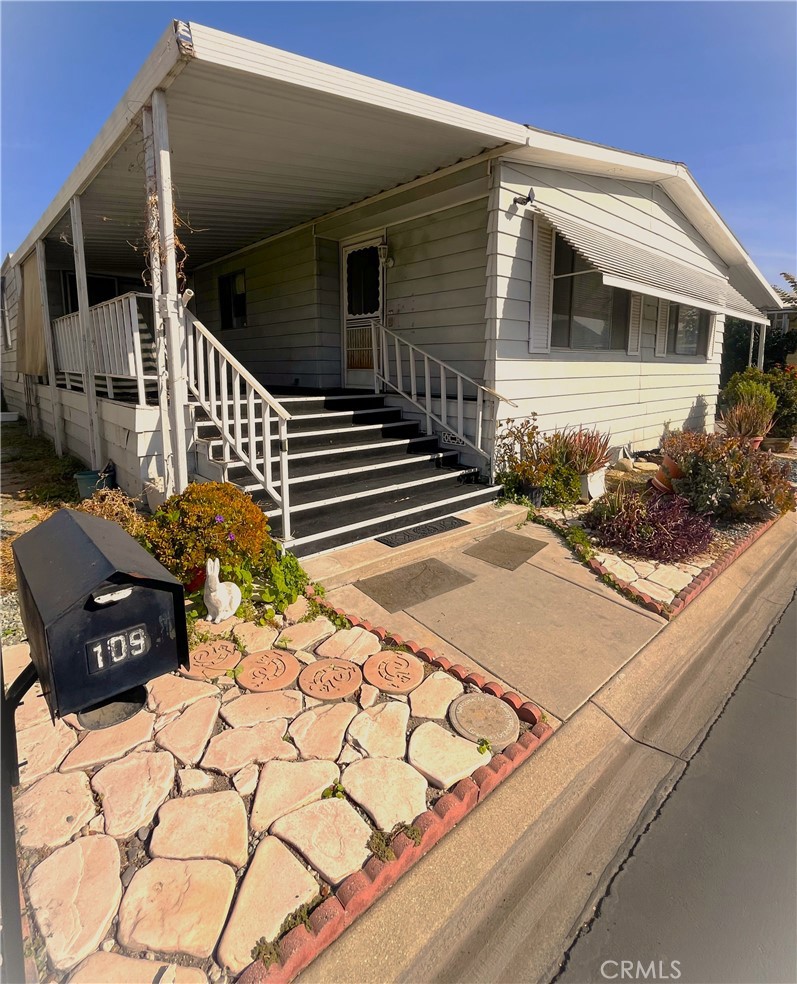 9391 California Avenue, Unit 109 Riverside, CA 92503 - Photo 9 of 9 a view of a house with a yard