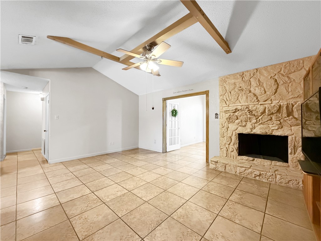 910 Twite Circle Corpus Christi, TX 78418 - Photo 17 of 39 a view of a livingroom with an empty space and a fireplace