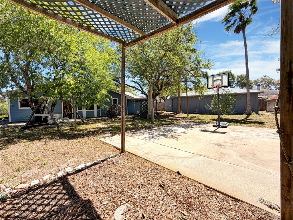 910 Twite Circle Corpus Christi, TX 78418 - Photo 34 of 39 a view of a backyard with a fountain