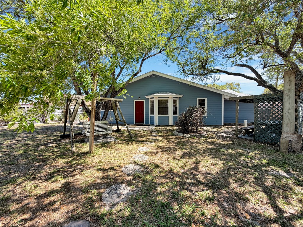 910 Twite Circle Corpus Christi, TX 78418 - Photo 35 of 39 a backyard of a house with table and chairs