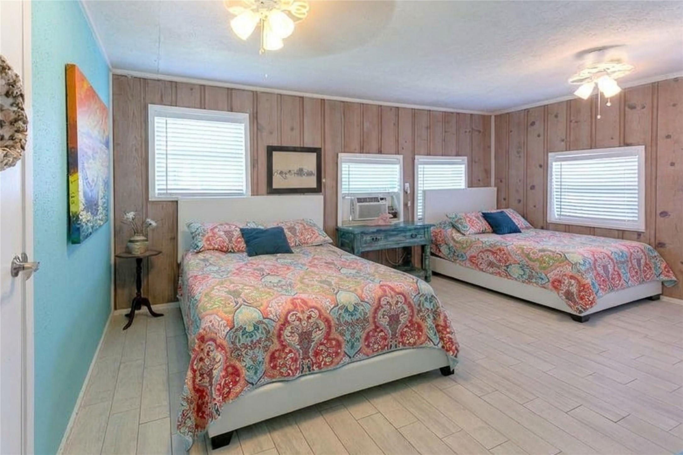959 South East Road Crystal Beach, TX 77650 - Photo 14 of 20 a bedroom with two beds and a window