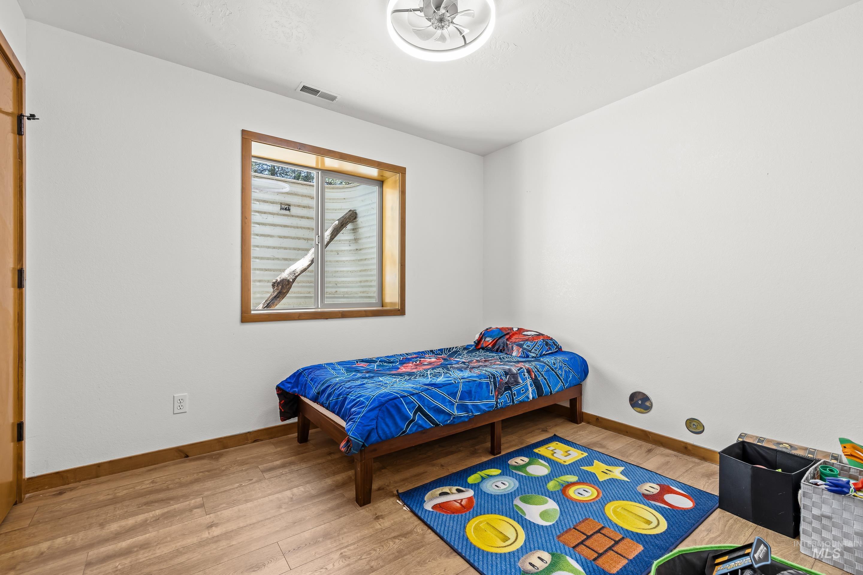 92 Cruickshank Road Horseshoe Bend, ID 83629 - Photo 33 of 50 White-painted interior walls with wood-finish flooring
