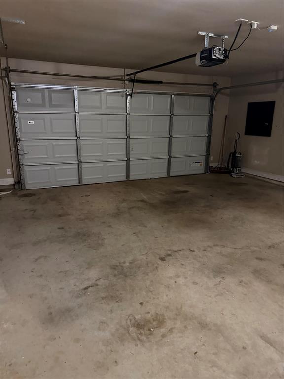 520 Big Red Circle Haughton, LA 71037 - Photo 20 of 25 Two-car garage with an automatic door opener and concrete flooring