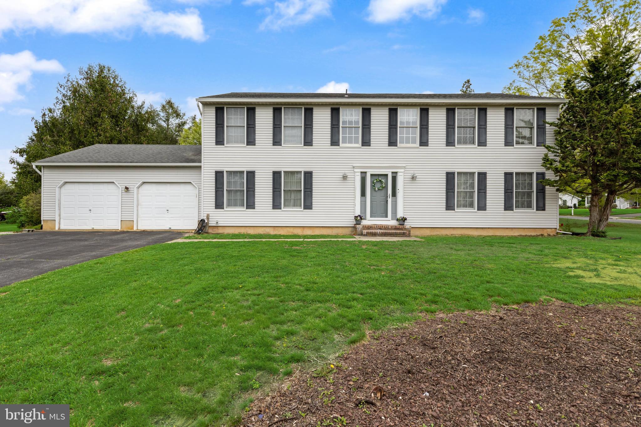 3 Quail Ridge Drive Bridgeton, NJ 08302 - Photo 1 of 34 a front view of a house with a garden and trees