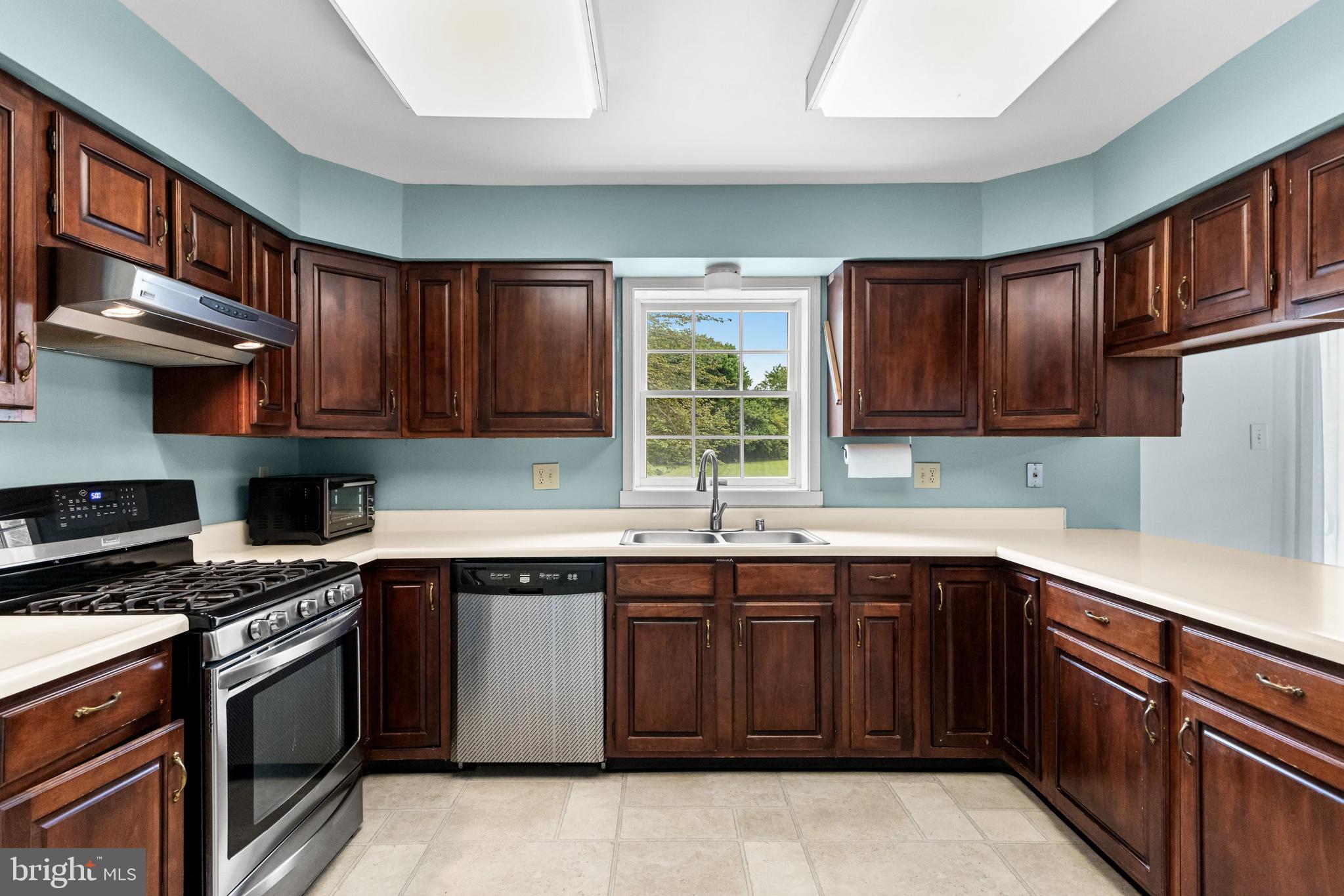 3 Quail Ridge Drive Bridgeton, NJ 08302 - Photo 10 of 34 a kitchen with a sink stove top oven and cabinets