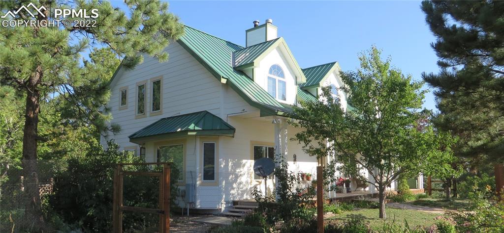 Undisclosed Address Elbert, CO 80106 - Photo 1 of 37 a front view of a house with garden