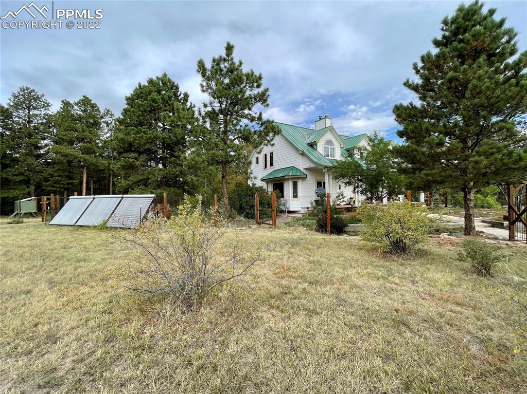 Undisclosed Address Elbert, CO 80106 - Photo 23 of 37 a front view of a house with a yard