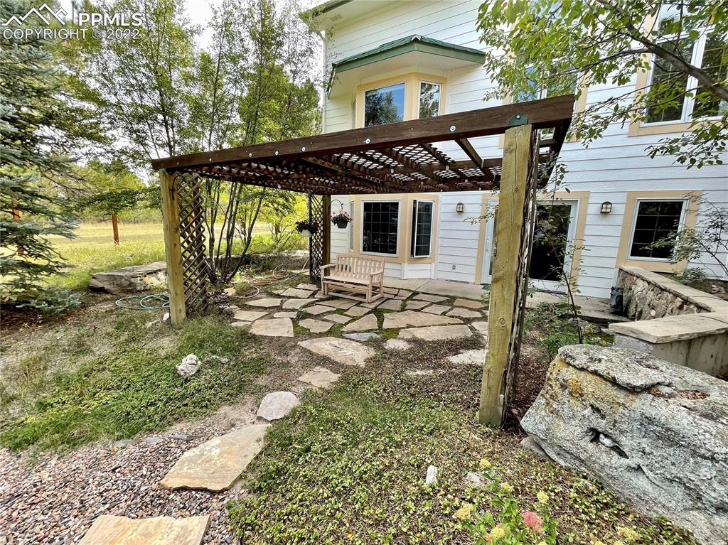 Undisclosed Address Elbert, CO 80106 - Photo 30 of 37 a front view of a house with garden
