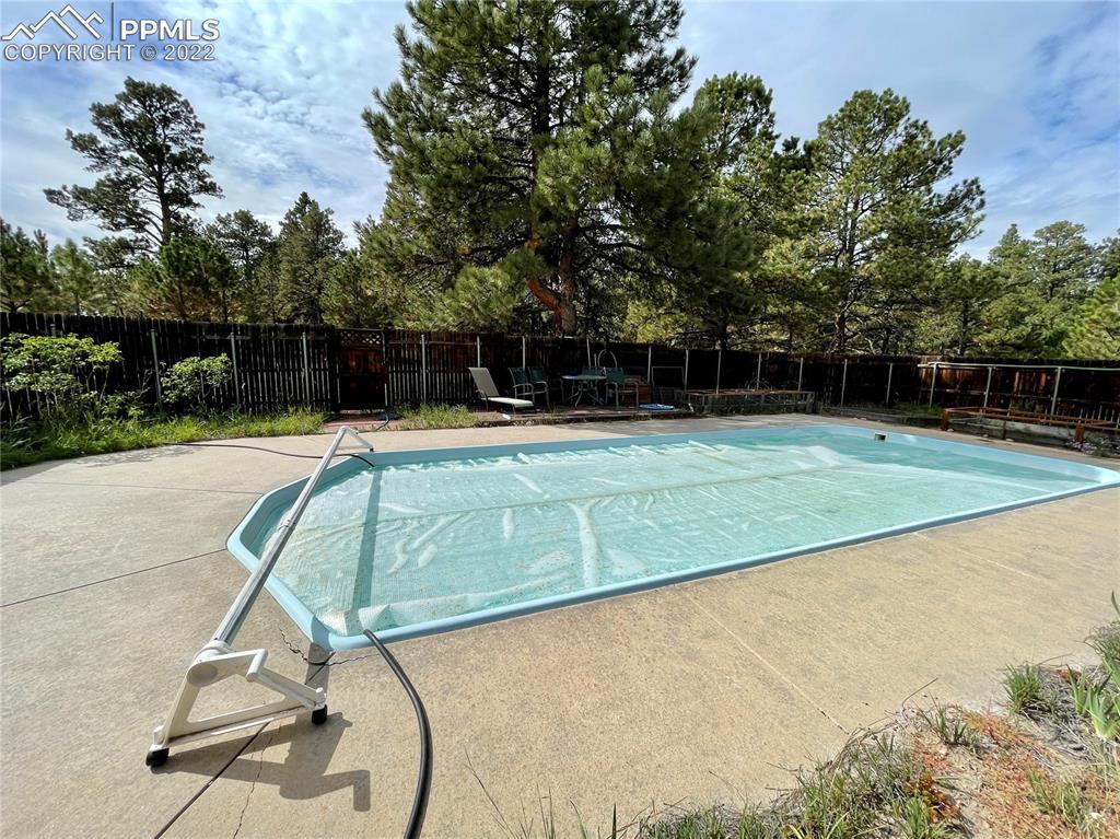 Undisclosed Address Elbert, CO 80106 - Photo 31 of 37 a view of a swimming pool with a patio