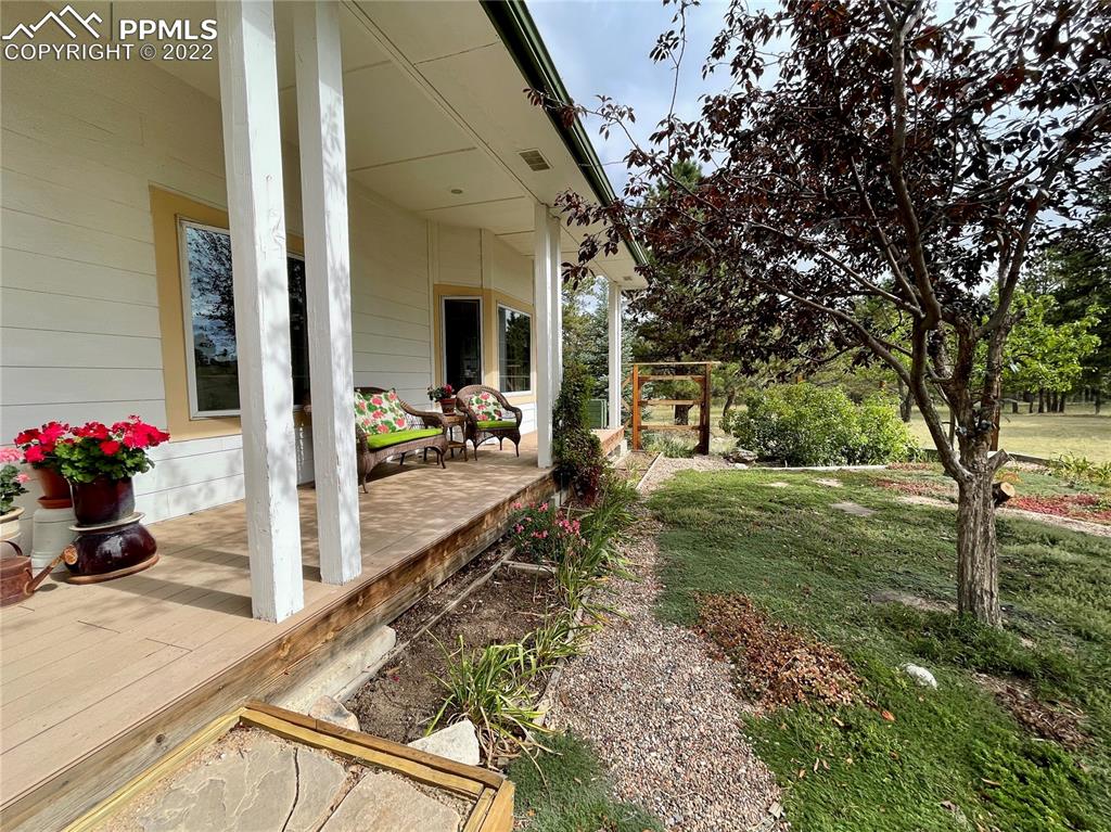 Undisclosed Address Elbert, CO 80106 - Photo 36 of 37 a view of a porch with furniture and garden