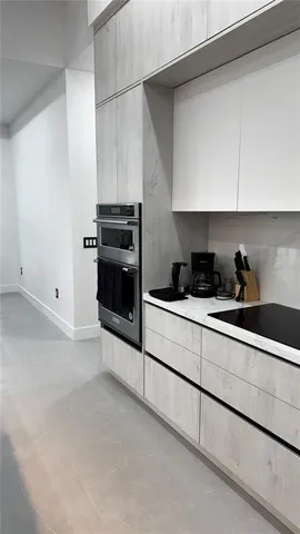 a view of living room with wooden floor