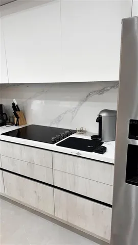 a bedroom with a large bed and a rug